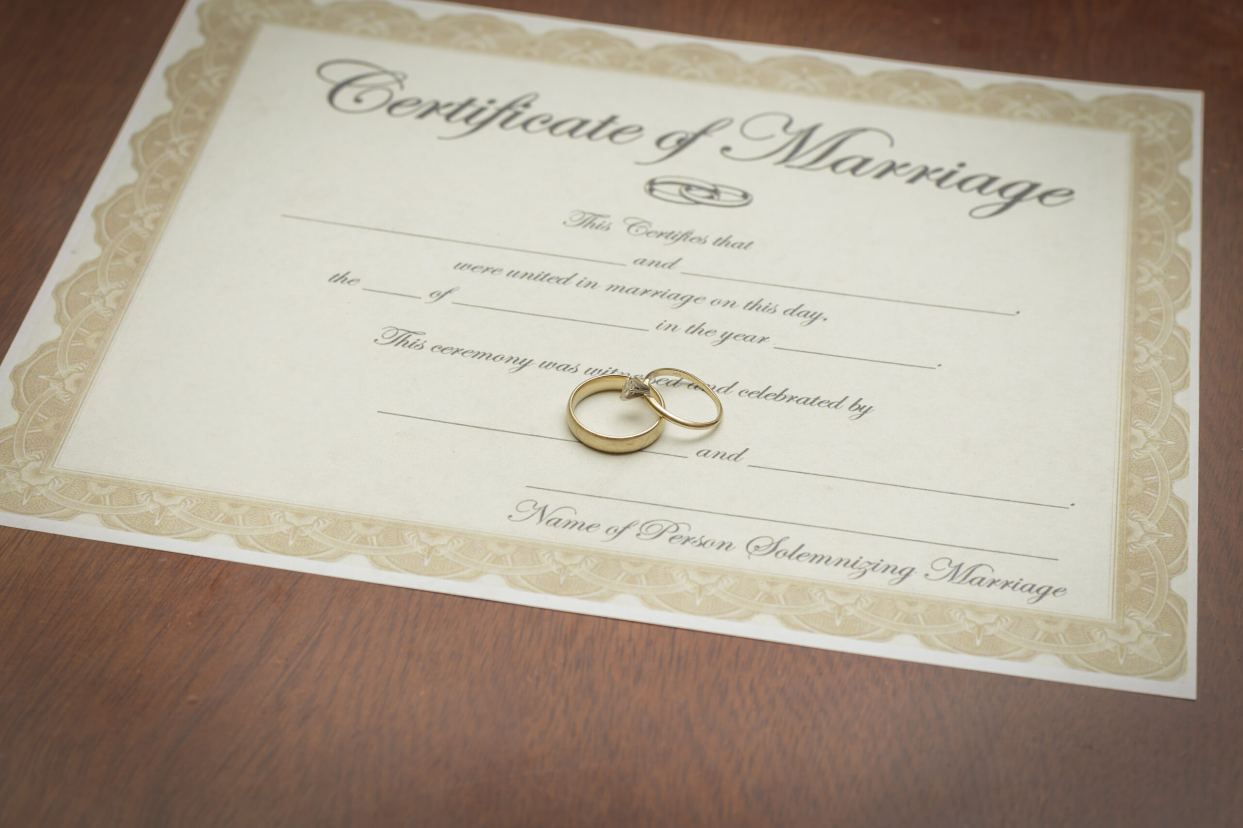 Gold,Wedding,Rings,On,A,Marriage,Certificate